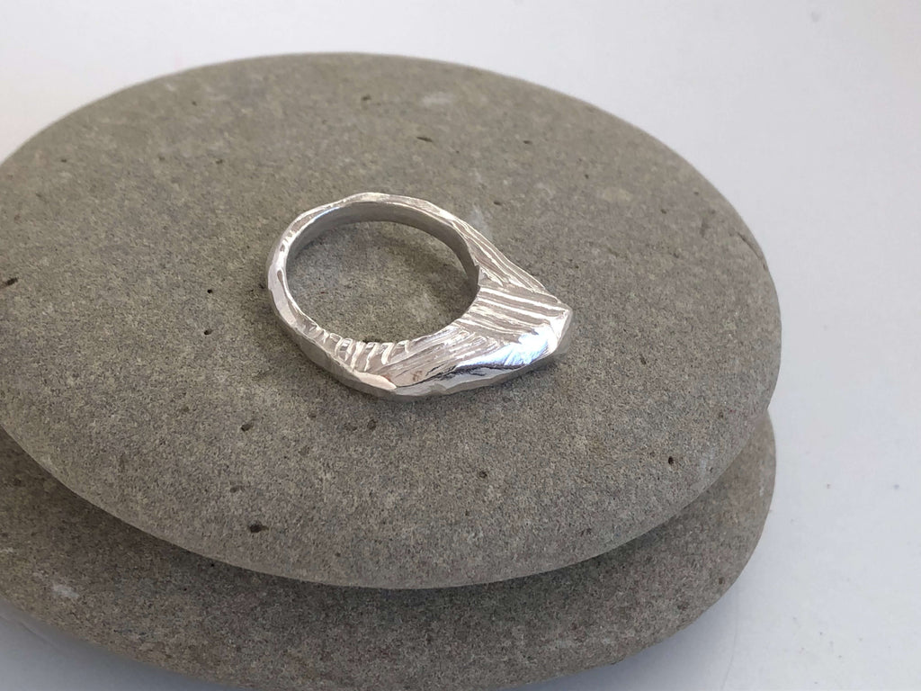 Asymmetric carved ring